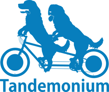 Tandemonium's logo: a light blue silhouette of two dogs riding a tandem bicycle, over the word 'Tandemonium'